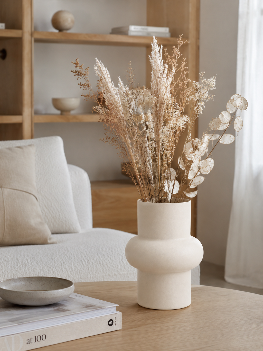 Cream metal vase with flowers